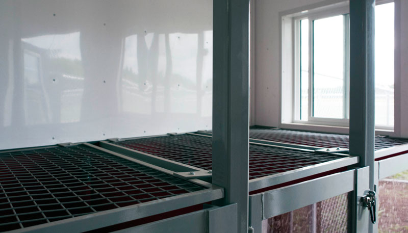 Large sliding windows allow airflow & natural sunlight filling kennel rooms & open grill tops for air circulation